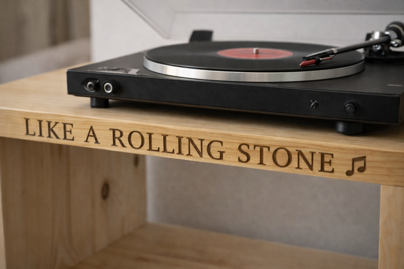 Handcrafted personalised turntable stand engraved with 'Like a Rolling Stone' — a unique Father's Day gift from The Rolling Cow